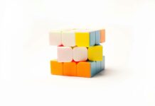 “뇌 건강 지키기, 일상 속 작은 변화에서 시작하세요” a stack of colorful blocks sitting on top of each other